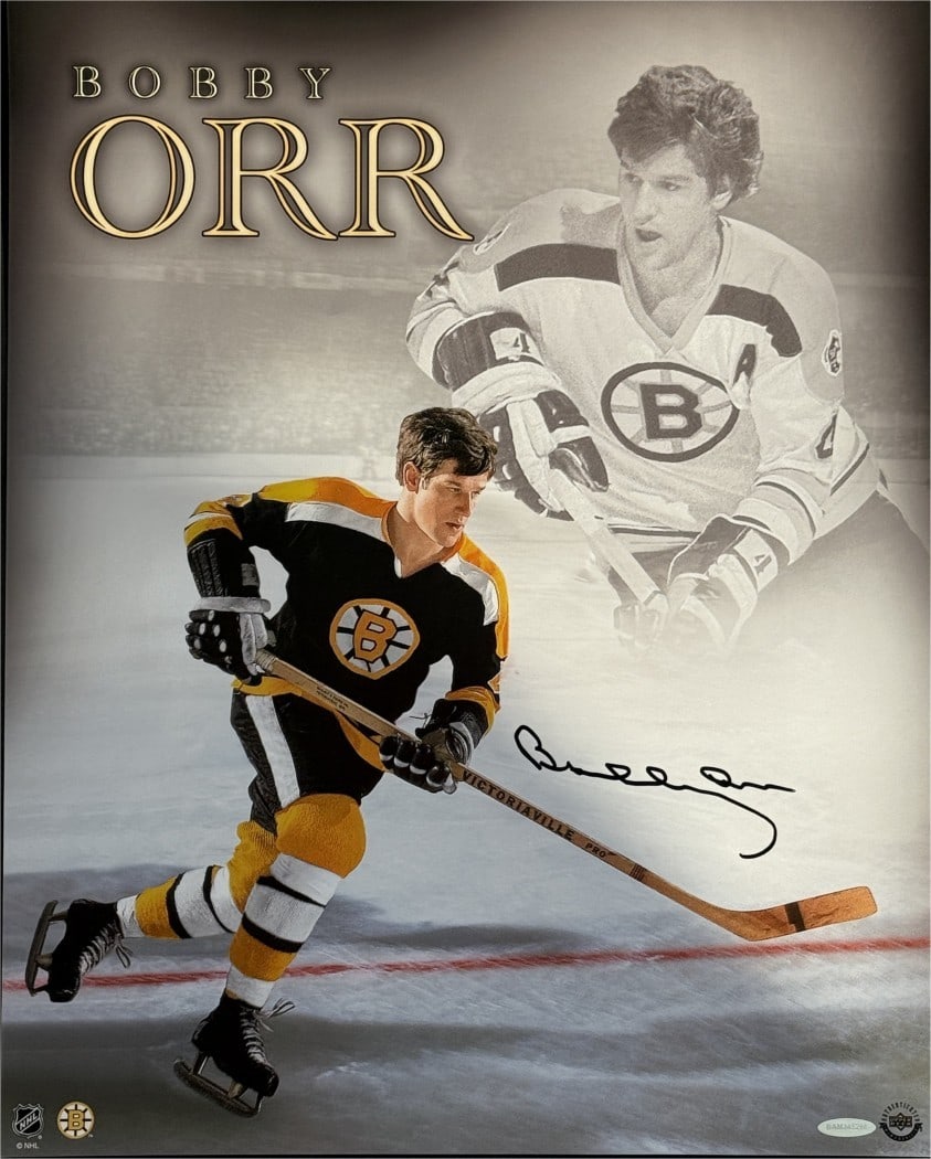 16x20 Photo Signed by Bobby Orr with Upper Deck Authentication Bruins: 16x20 Photo Signed by Bobby Orr with Upper Deck Authentication Bruins This is an original 16x20 photo signed by Bobby Orr, featuring the inscription "Excellence Redefined." The photo showcases the leg