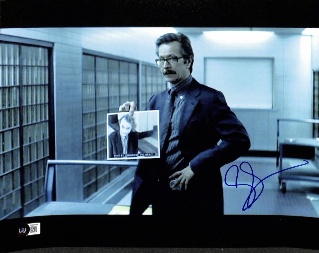 Gary Oldman Signed 11x14 Dark Knight Photo BECKETT Certified: Gary Oldman Signed 11x14 Dark Knight Photo BECKETT Certified This remarkable 11x14 photograph features Gary Oldman as Commissioner Gordon from "The Dark Knight," expertly signed in blue permanent mark
