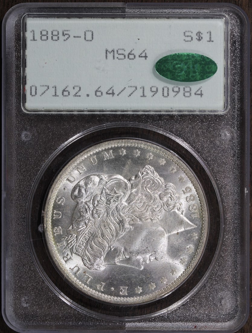 1885 O Morgan Silver Dollar PCGS Rattler MS64 CAC: 1885 O Morgan Silver Dollar PCGS Rattler MS64 CAC This is an 1885-O Morgan Silver Dollar graded MS64 by PCGS and housed in an old 'Rattler' holder. The coin is uncirculated and features a composition 