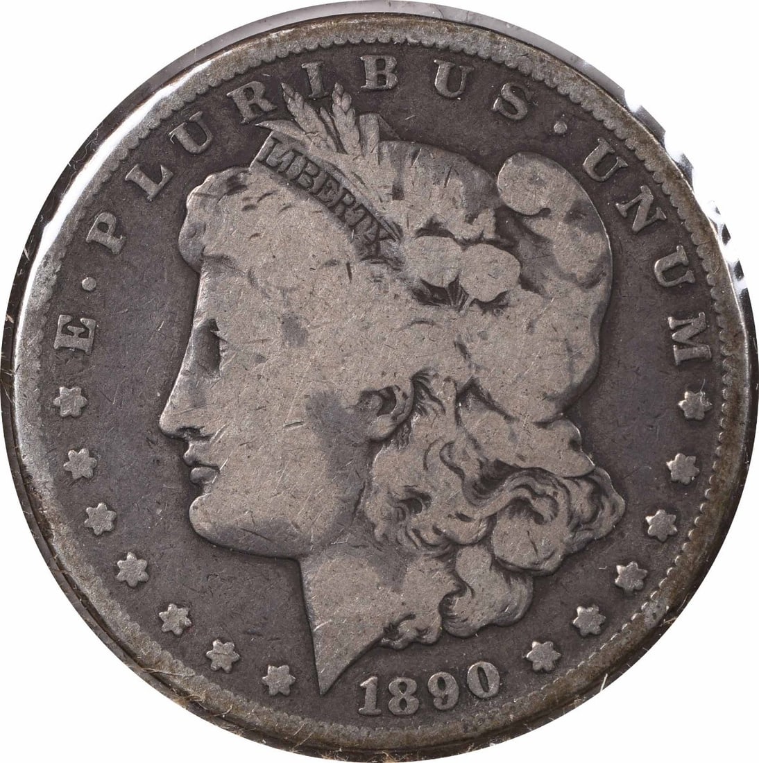 VG 1890 Carson City Morgan Dollar Tail Bar Variety Uncertified Silver Coin: VG 1890 Carson City Morgan Dollar Tail Bar Variety Uncertified Silver Coin This 1890-CC Morgan Silver Dollar is a circulated coin minted in Carson City. Composed of 90% silver and 10% copper, this coi