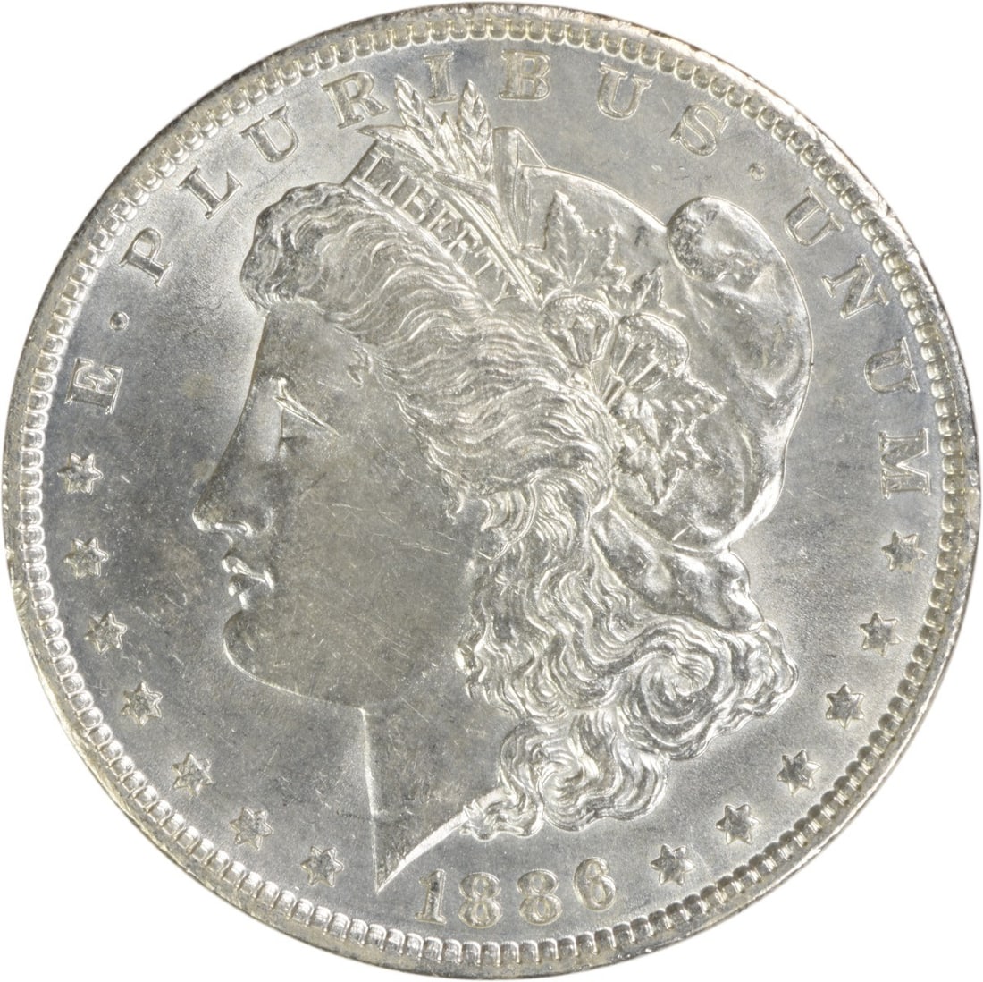 Brilliant Uncirculated 1886 Morgan Silver Dollar Uncertified Philadelphia Mint: Brilliant Uncirculated 1886 Morgan Silver Dollar Uncertified Philadelphia Mint This 1886 Morgan Silver Dollar features brilliant uncirculated condition and is uncertified. Struck in silver without a m