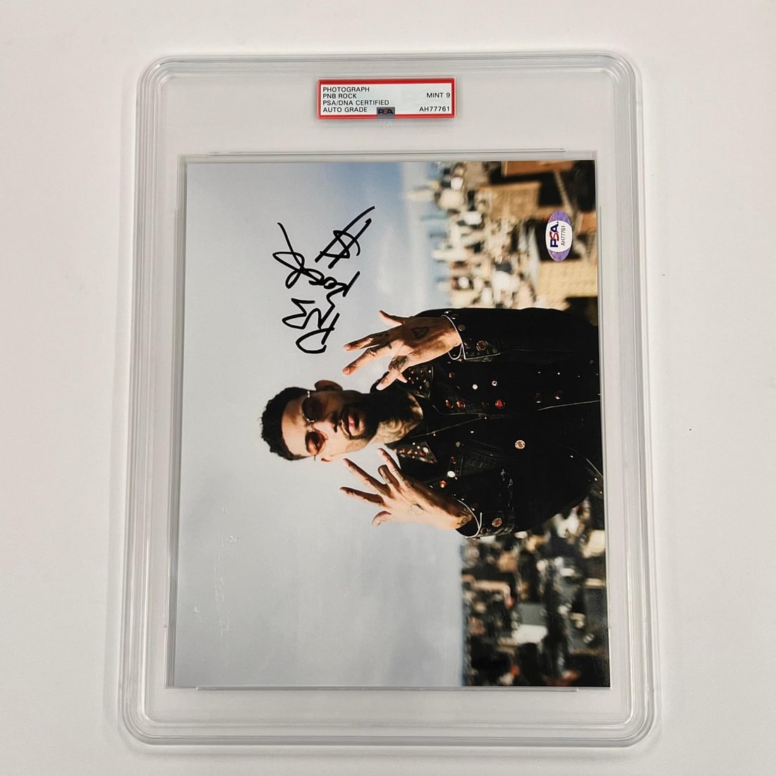 PNB Rock Autographed 8x10 Photo PSA/DNA Certified Mint 9: PNB Rock Autographed 8x10 Photo PSA/DNA Certified Mint 9 This is a professionally printed 8x10 photograph featuring PNB Rock, a renowned rapper, that has been autographed by him. The signature has bee