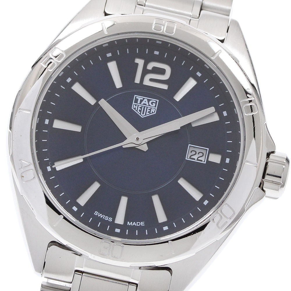 TAG Heuer Formula 1 Quartz Ladies Date Watch WBJ1412: TAG Heuer Formula 1 Quartz Ladies Date Watch WBJ1412 This TAG Heuer Formula 1 Date Quartz women's wristwatch features a stainless steel case and bracelet with a striking blue dial. The watch is powere