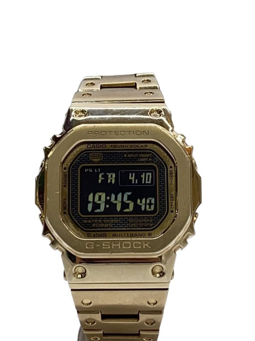 Casio G Shock Gold Full Metal GMW B5000GD 9JF Men's Wristwatch: Casio G Shock Gold Full Metal GMW B5000GD 9JF Men's Wristwatch This CASIO G-SHOCK Full Metal Multi-Band 6 GMW-B5000GD-9JF is a men's wristwatch crafted in Japan. Featuring a gold-toned case and band, 