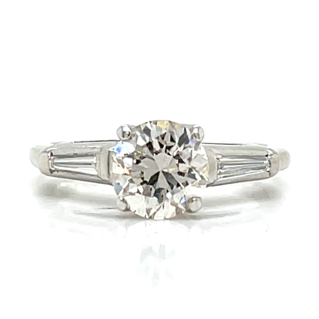 Platinum 1.25 Ct Diamond Ring with I-J SI1 Center Stone: Platinum 1.25 Ct Diamond Ring with I-J SI1 Center Stone This exquisite platinum diamond ring features a stunning center stone weighing approximately 1.00 Ct., showcasing I-J color and SI1 clarity. Com