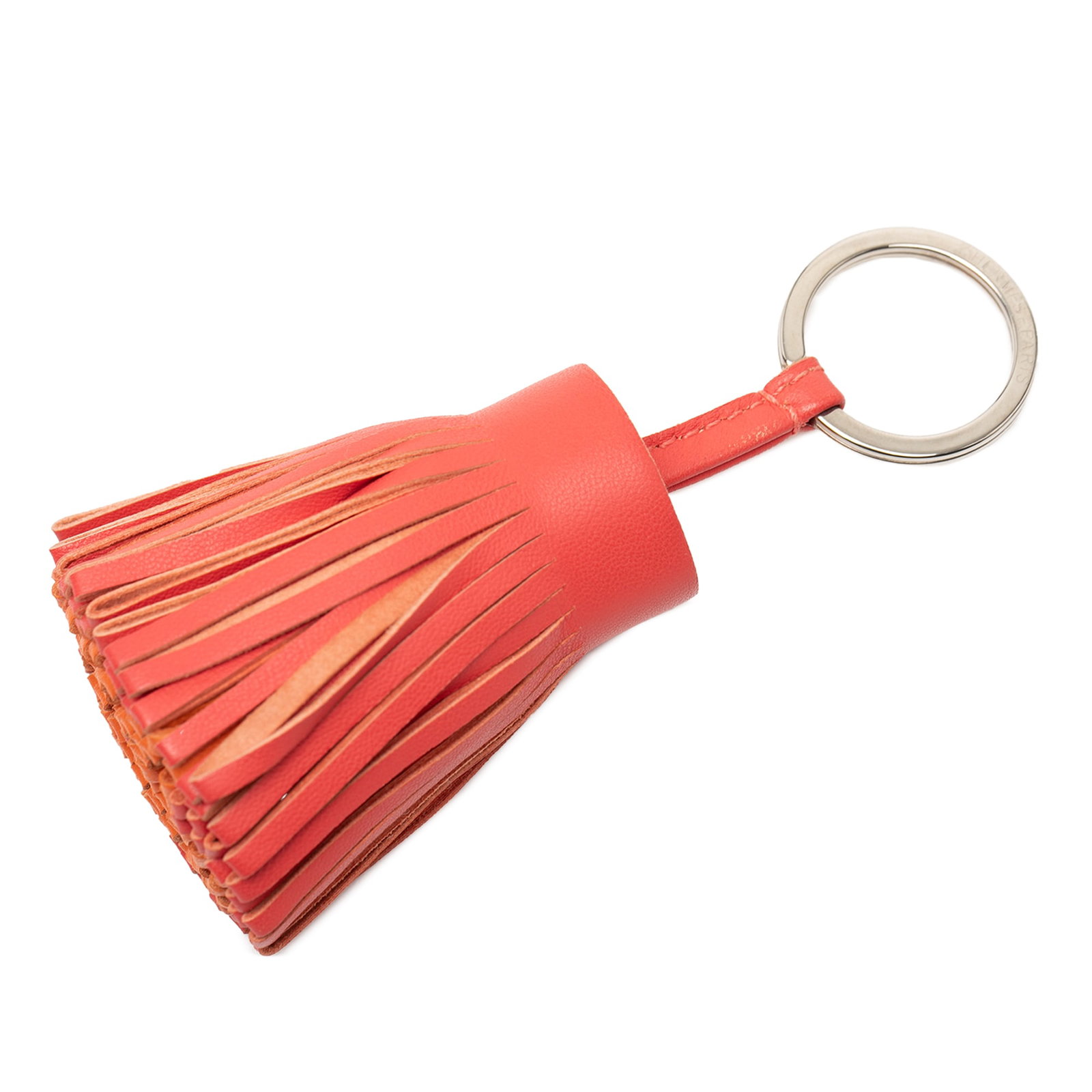 Hermes Carmen Orange Lambskin Leather Tassel Keychain Accessory: Hermes Carmen Orange Lambskin Leather Tassel Keychain Accessory This Hermes Milo Lambskin Carmen Key Ring features a lambskin leather tassel design in orange, paired with a silver-tone metal ring. It 
