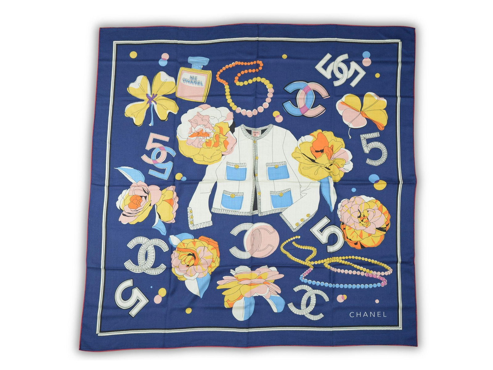 Chanel 50 in Silk Navy Shawl: Chanel 50 in Silk Navy Shawl This Chanel silk shawl showcases iconic Chanel accessory motifs set against a navy blue background. Crafted from 100% silk, it offers a luxurious feel and elegant drape. M