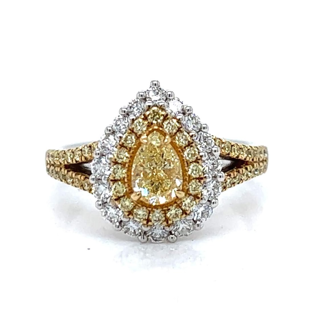 Stunning 18K White Gold Fancy Yellow Diamond Ring: Stunning 18K White Gold Fancy Yellow Diamond Ring This exquisite 18K white gold ring features a stunning 0.64 Ct. fancy yellow diamond at its center, complemented by 0.46 Ct. of yellow diamonds set in