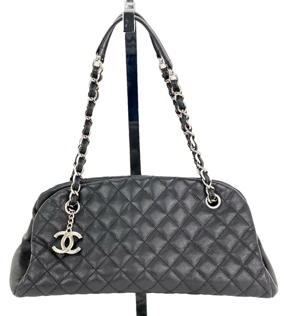 CHANEL Mademoiselle Quilted Caviar Black Leather Shoulder Bag with Charm: CHANEL Mademoiselle Quilted Caviar Black Leather Shoulder Bag with Charm Introducing the CHANEL Just Mademoiselle Quilted Caviar Black Leather Bowling Shoulder Bag. This elegant medium-sized shoulder 