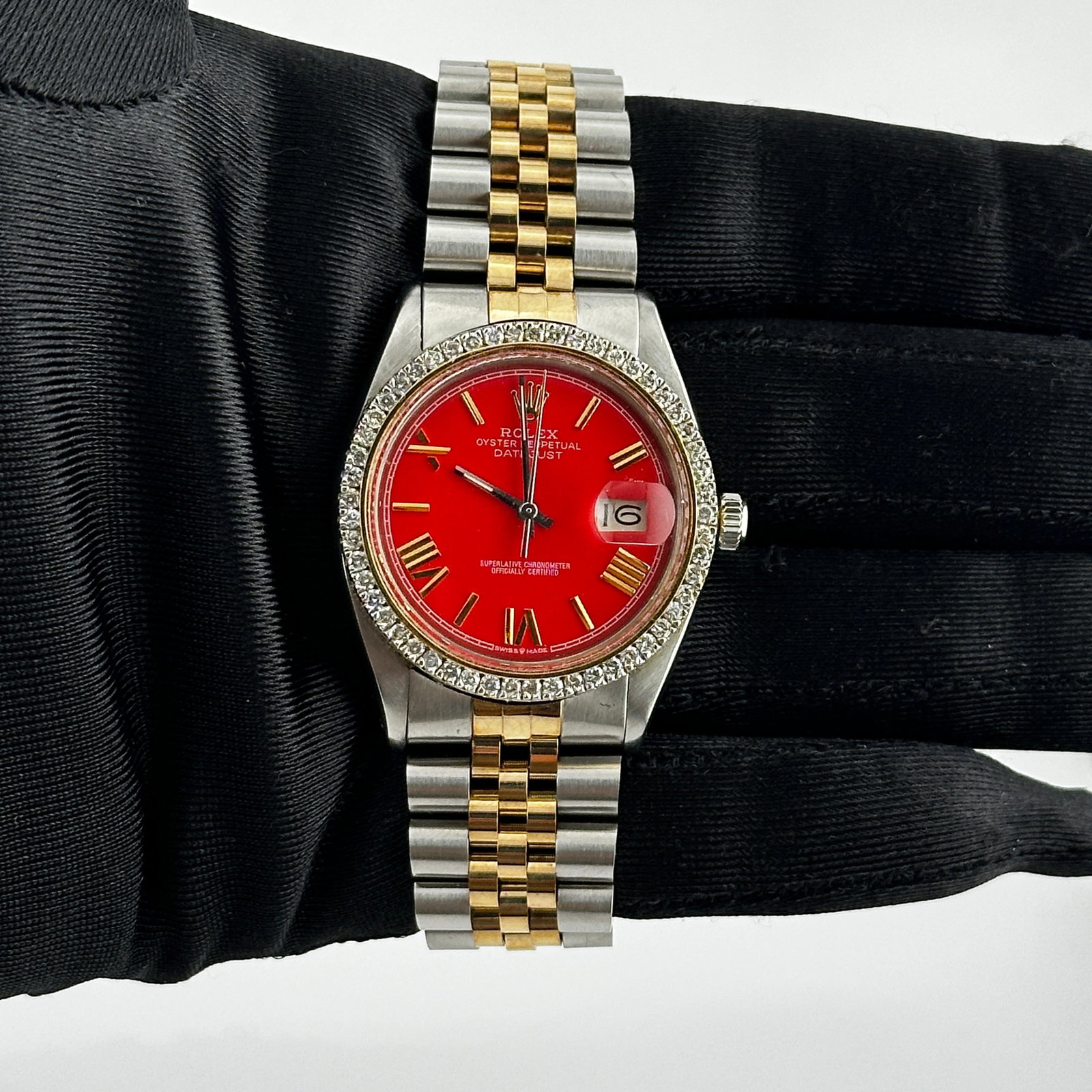 Aftermarket Red Roman Dial Jubilee Bracelet Datejust Watch Ref 1601: Aftermarket Red Roman Dial Jubilee Bracelet Datejust Watch Ref 1601 This men's Rolex Datejust features an aftermarket red Roman stick dial and a prong-plated diamond bezel. The watch is equipped with 