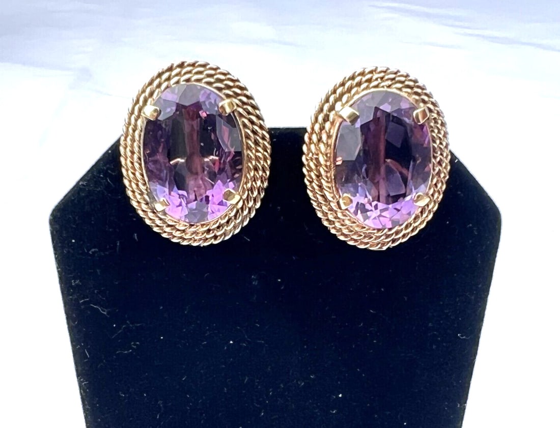 Elegant 14K Yellow Gold Amethyst Earrings 12 ct Signed: Elegant 14K Yellow Gold Amethyst Earrings 12 ct Signed This exquisite pair of 14K yellow gold amethyst earrings features a stunning design and exceptional craftsmanship. Each earring is crafted from 1