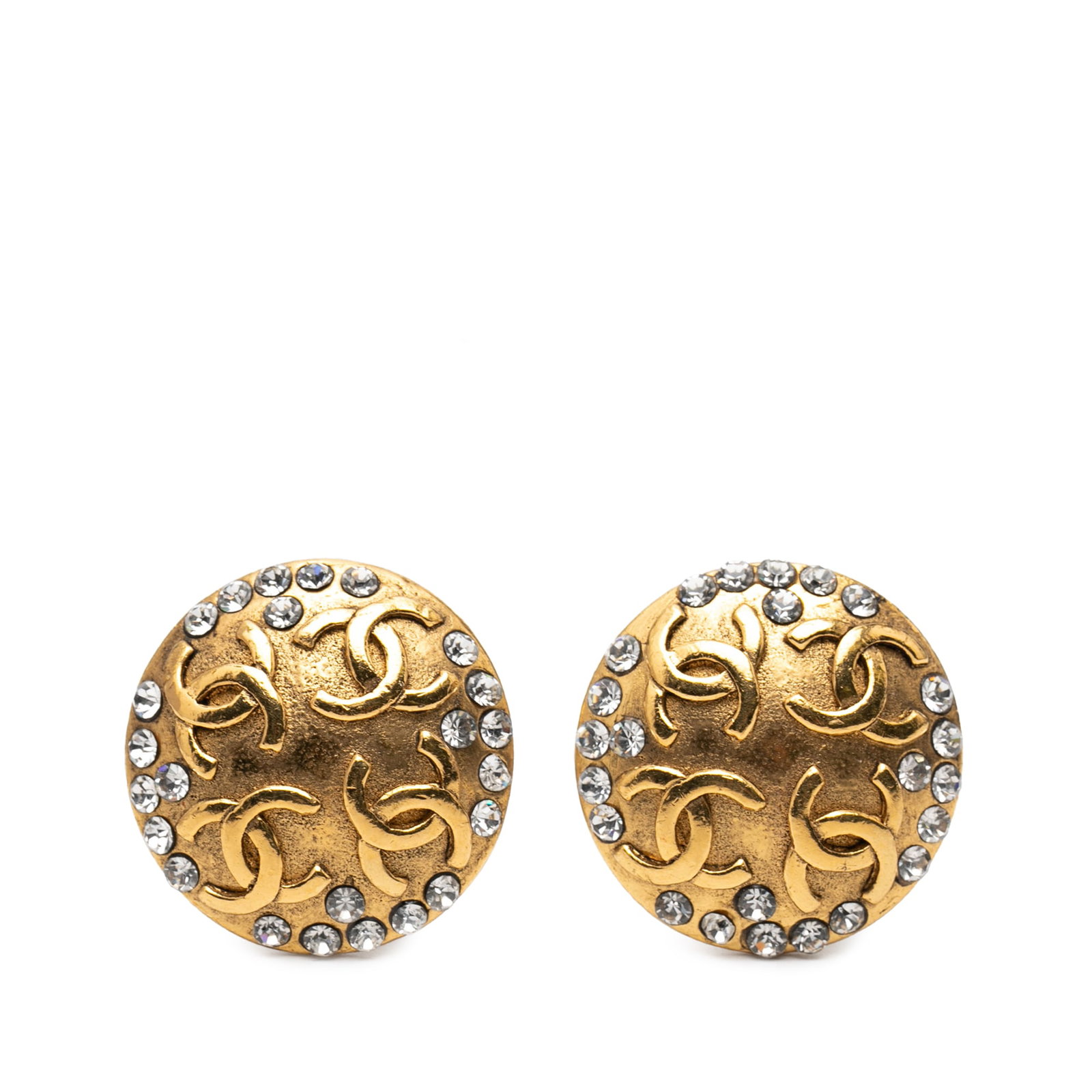Chanel CC Crystal Gold Plated Round Clip On Earrings: Chanel CC Crystal Gold Plated Round Clip On Earrings These Chanel earrings feature a gold-plated metal body adorned with rhinestone details and clip-on closures. Designed in a round shape with the ico