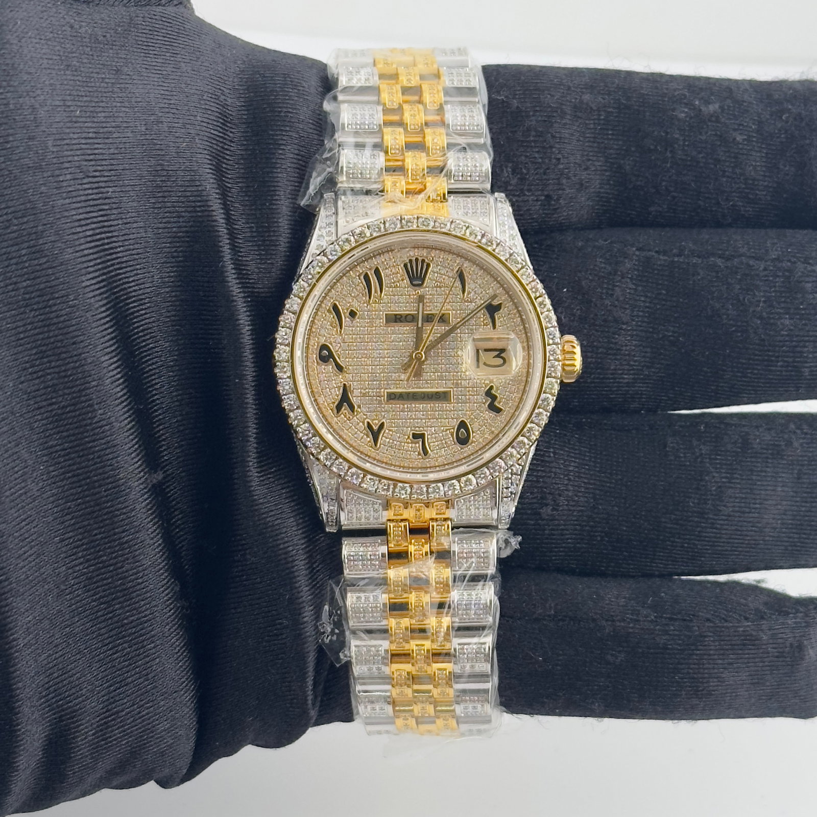 Rolex Datejust 1601 Mens Watch with Diamond Prong Bezel and Arabic Dial Aftermarket: Rolex Datejust 1601 Mens Watch with Diamond Prong Bezel and Arabic Dial Aftermarket This Rolex Datejust features an iced out Arabic dial and an iced out Jubilee bracelet. The watch is equipped with a 