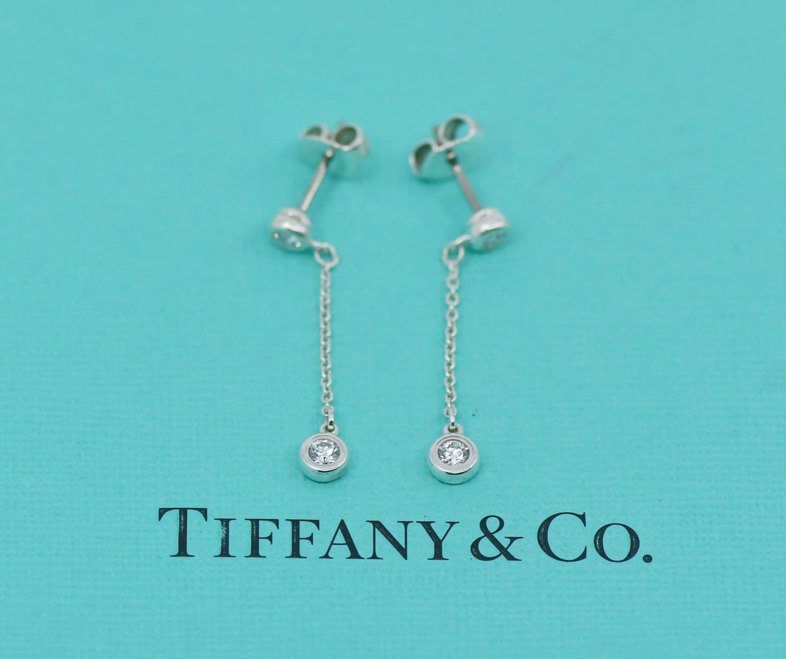 Elsa Peretti Dangle Earrings in Sterling Silver with Diamond by Tiffany & Co: Elsa Peretti Dangle Earrings in Sterling Silver with Diamond by Tiffany & Co These Tiffany & Co. Elsa Peretti earrings feature a dangle/drop design crafted from sterling silver with diamond accents. T