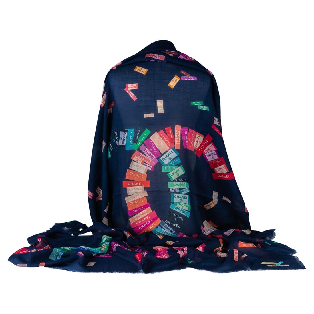 Chanel New Navy Cashmere Shawl with Multicolor Labels 52 x 76 in: Chanel New Navy Cashmere Shawl with Multicolor Labels 52 x 76 in Introducing a luxurious new navy cashmere shawl from Chanel, featuring a stunning multicolor labels design. This shawl is exceptionally