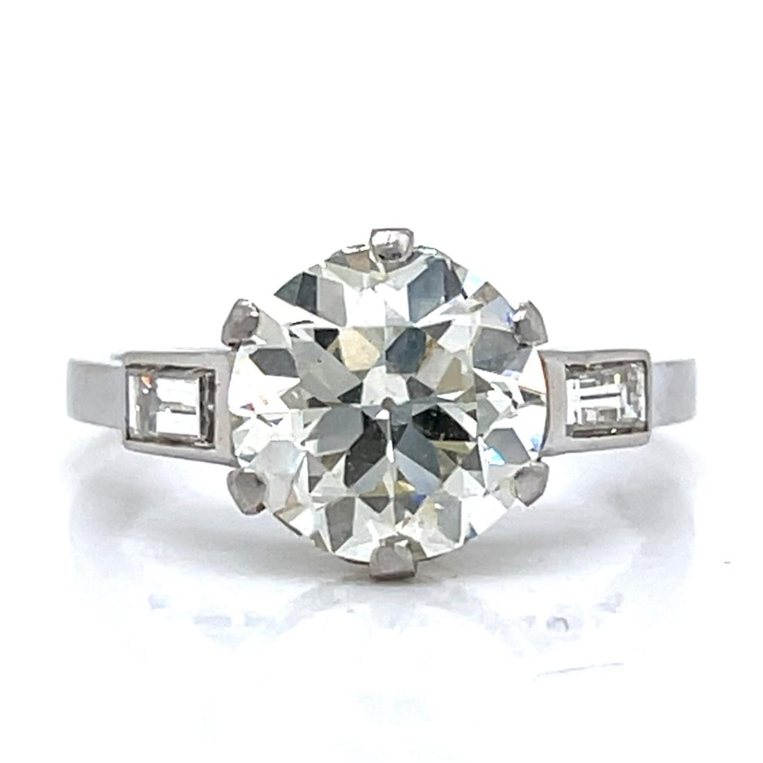 Platinum Art Deco Diamond Ring Featuring 2.96 Carat Center Stone: Platinum Art Deco Diamond Ring Featuring 2.96 Carat Center Stone This Art Deco engagement ring features a 2.96 carat European-cut diamond with L color and SI1 clarity, set in platinum. The ring is fur