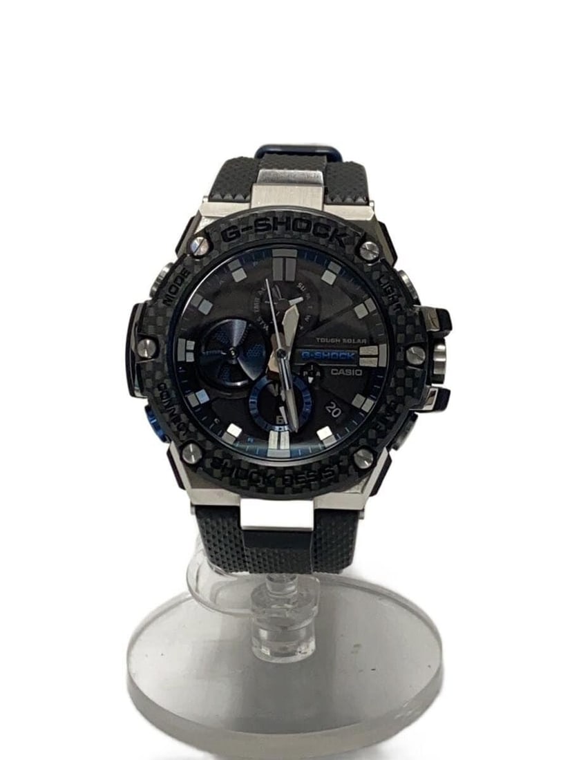 Casio G Shock G Steel Carbon Bezel Tough Solar GST B100XA 1AJF Watch: Casio G Shock G Steel Carbon Bezel Tough Solar GST B100XA 1AJF Watch This Casio G-SHOCK G-STEEL Tough Solar Carbon Bezel GST-B100XA-1AJF wristwatch is designed for men and features a durable construct