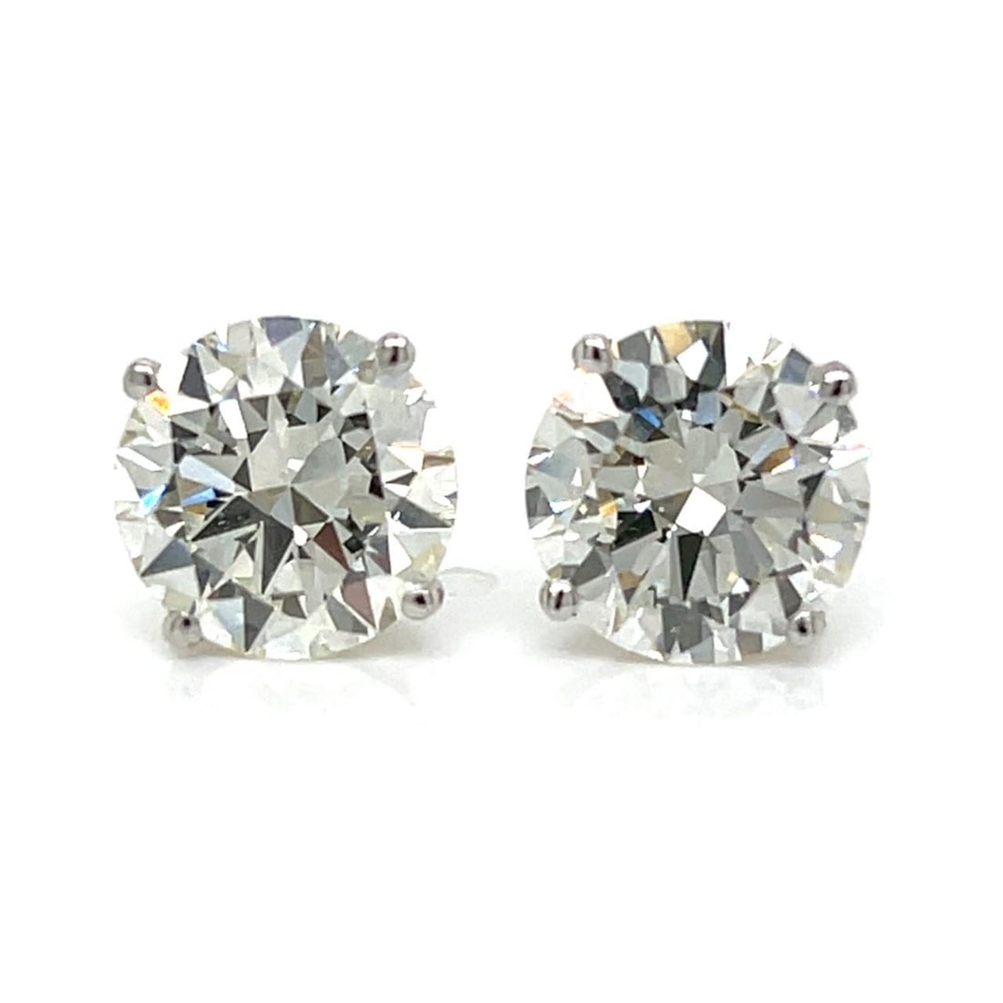 GIA Certified 6.02 Ct Diamond Stud Earrings in 14K White Gold: GIA Certified 6.02 Ct Diamond Stud Earrings in 14K White Gold These 14K white gold stud earrings feature two GIA certified diamonds, each weighing 3.01 carats, for a total of 6.02 carats. Both diamond