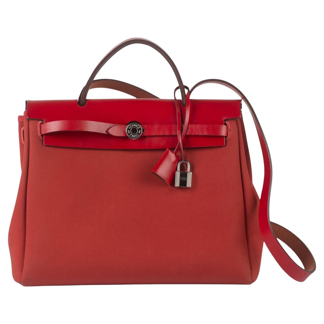 Red Herbag Zip 31 PM Tote with Hunter Leather and Canvas: Red Herbag Zip 31 PM Tote with Hunter Leather and Canvas This is an authentic Hermes Herbag Zip Retourne PM 31 tote in red. Crafted from durable toile canvas with natural Vache Hunter leather accents,