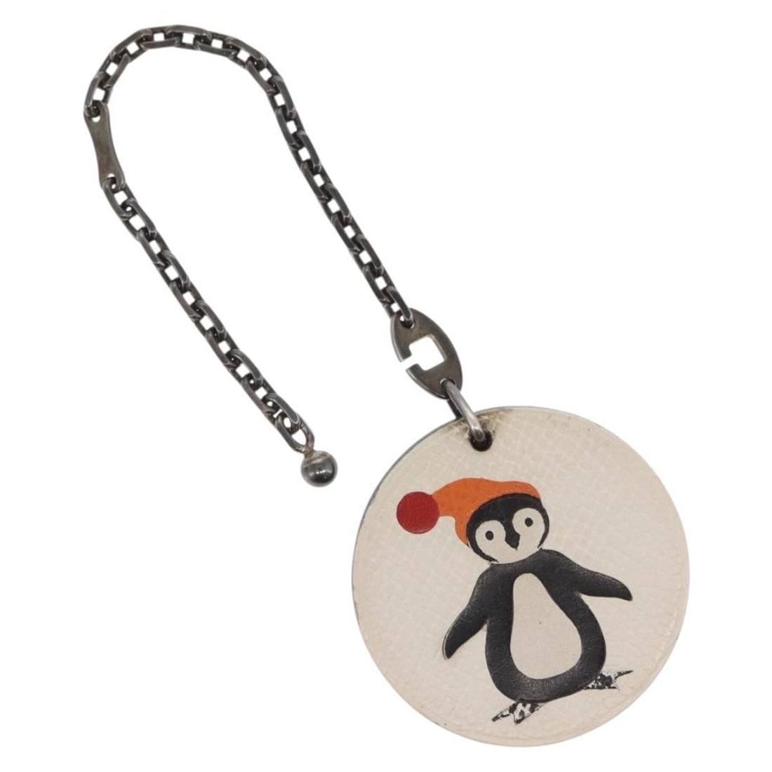 Penguin Leather White Brown Bag Charm by Hermes: Penguin Leather White Brown Bag Charm by Hermes This is an Hermes Penguin bag charm crafted from white and brown leather. The charm features a silver 925 stamped chain and is made in France. It is in 