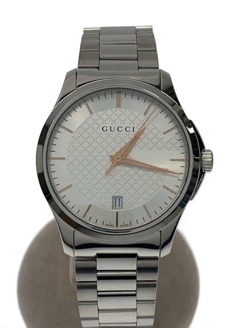 Gucci G-Timeless Quartz Silver Men's Wristwatch: Gucci G-Timeless Quartz Silver Men's Wristwatch This GUCCI G-TIMELESS Quartz 126.4 men's wristwatch features a silver-tone design and Swiss origin. It is in slightly used condition, offering a sophist
