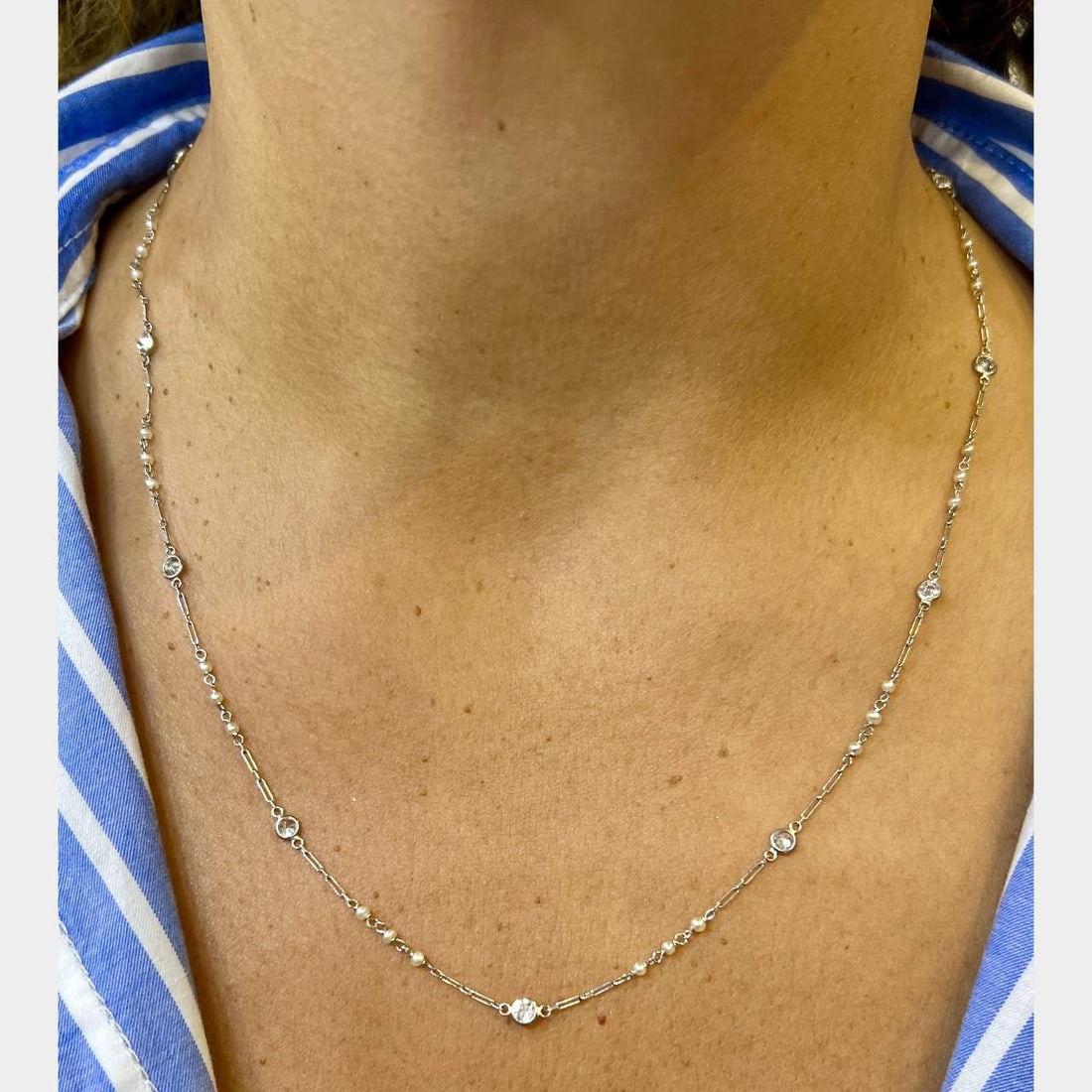 Elegant Platinum Pearl and Diamond Necklace 21 Inches: Elegant Platinum Pearl and Diamond Necklace 21 Inches This exquisite Platinum Natural Pearl & Diamond by the Yard Necklace features a stunning design adorned with 12 European-cut diamonds, totaling ap