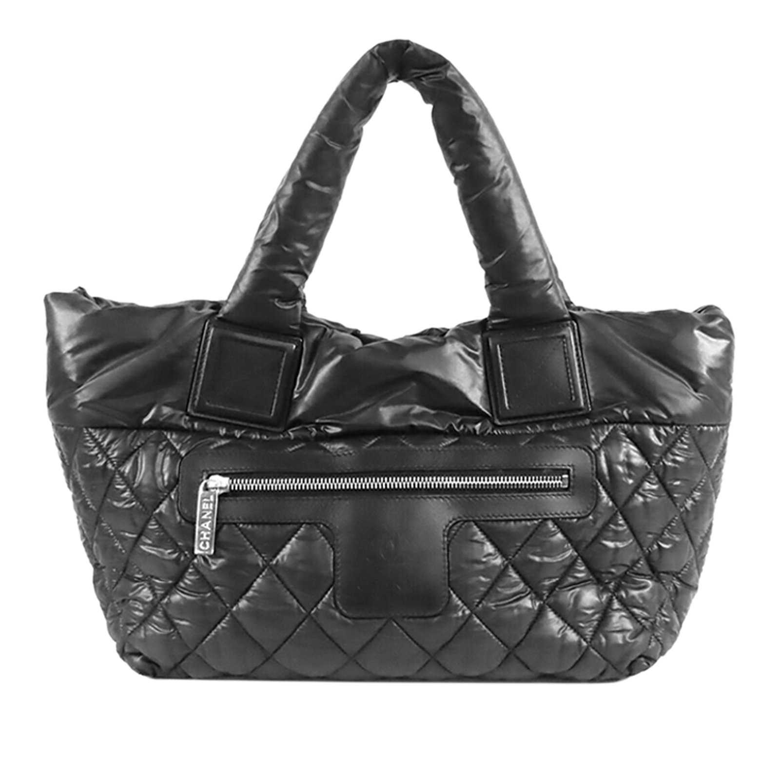 Chanel Coco Cocoon black quilted nylon tote: Chanel Coco Cocoon black quilted nylon tote This Chanel Small Quilted Nylon Coco Cocoon Tote features a quilted nylon body in black, rolled handles, an open top, a front exterior zip pocket, and an in