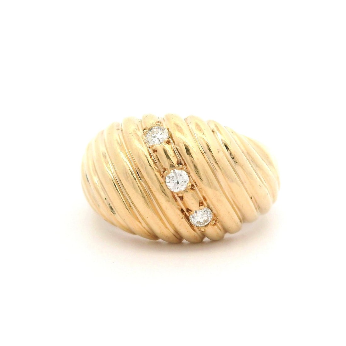 Vintage 14k Yellow Gold 0.12ctw Diamond Bombe Ring: Vintage 14k Yellow Gold 0.12ctw Diamond Bombe Ring This exquisite vintage dome ring features a striking bombe design crafted from 14k yellow gold. Adorned with three natural genuine diamonds, each rou