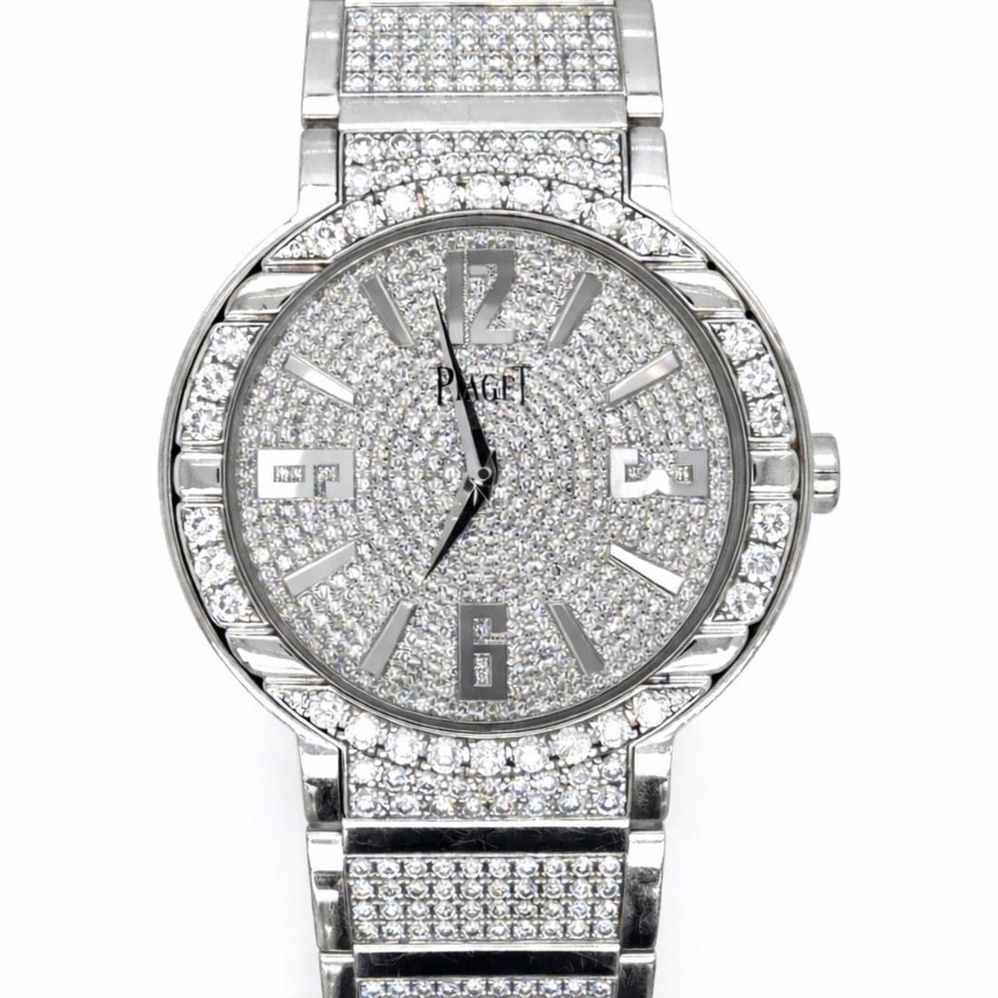 Polo Model 27705 18K White Gold 37mm Diamond Watch by Piaget: Polo Model 27705 18K White Gold 37mm Diamond Watch by Piaget This Piaget Polo men's watch features an 18K white gold case and bracelet, weighing 194.9 grams. The watch is set with approximately 900 fa