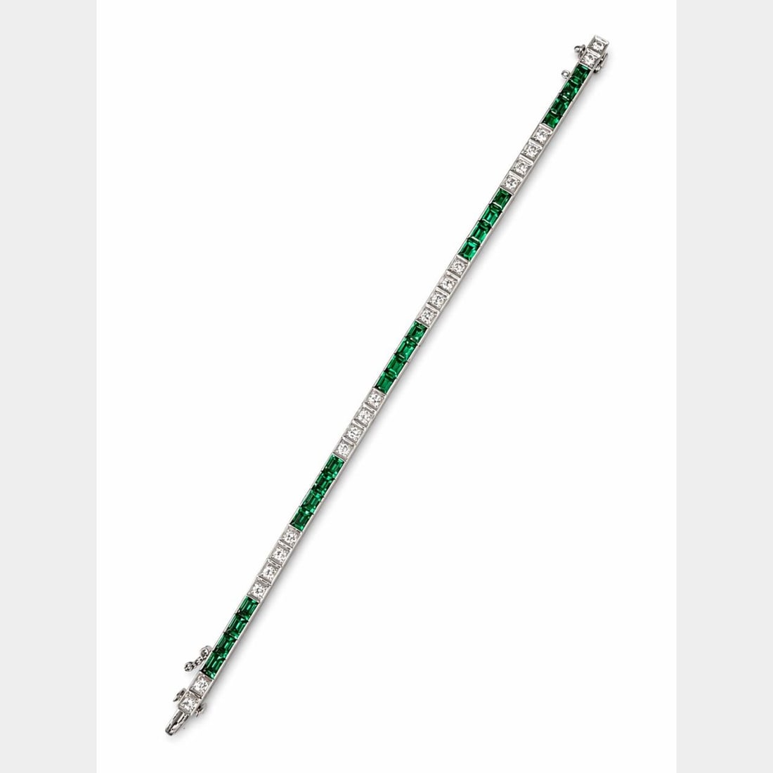 14K White Gold Tennis Bracelet with Diamonds and Synthetic Emeralds 1960s: 14K White Gold Tennis Bracelet with Diamonds and Synthetic Emeralds 1960s This 1960s tennis bracelet is crafted from 14K white gold and features approximately 6.00 carats of synthetic emeralds, measur