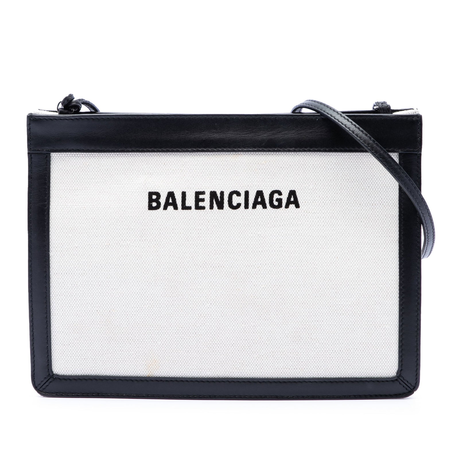 Balenciaga Navy Pochette Canvas Crossbody Bag: Balenciaga Navy Pochette Canvas Crossbody Bag This Balenciaga Canvas Navy Pochette Crossbody bag features a canvas body with leather trim and an adjustable flat leather shoulder strap. It offers both 