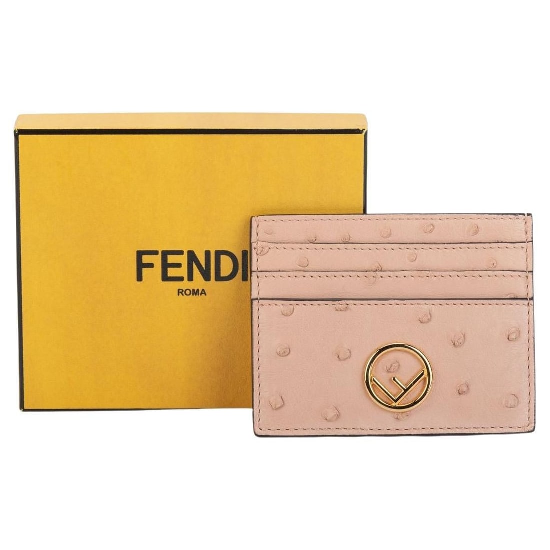 Fendi Ostrich Leather Card Holder Powder Pink with Gold Logo: Fendi Ostrich Leather Card Holder Powder Pink with Gold Logo Elevate your accessory collection with this exquisite Fendi card holder, meticulously crafted in Italy from luxurious ostrich leather in a 