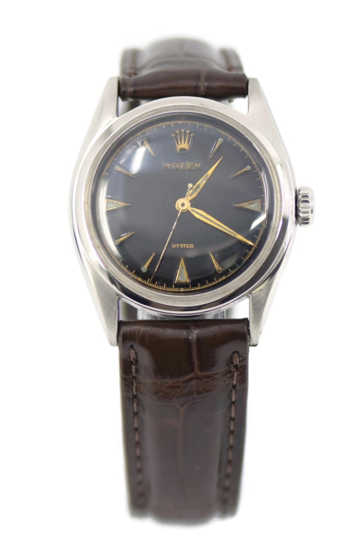 Rolex Oyster 6022 Stainless Steel Watch with Black Dial: Rolex Oyster 6022 Stainless Steel Watch with Black Dial Discover the elegance of the Rolex Oyster Stainless Steel Watch, model 6022. This stunning wristwatch features a classic analog display and is p