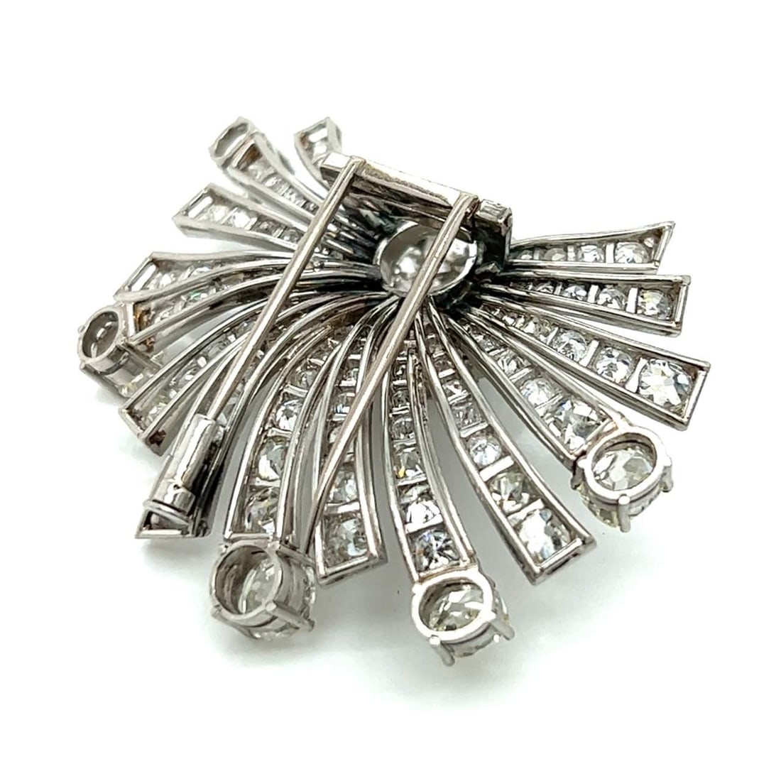 Art Deco Platinum Brooch 12.20 Ct Diamonds K Color I1 Clarity: Art Deco Platinum Brooch 12.20 Ct Diamonds K Color I1 Clarity This exquisite Art Deco brooch is crafted in platinum and features a stunning total of 12.20 carats of diamonds. At its center lies a prom