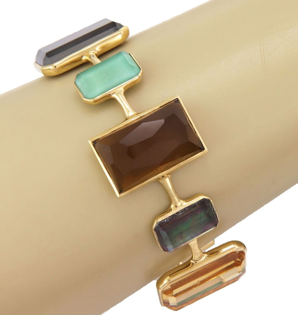 Ippolita Rock Candy Gelato 18k Gold Gemstone Bangle Bracelet: Ippolita Rock Candy Gelato 18k Gold Gemstone Bangle Bracelet This Ippolita Rock Candy Gelato bracelet features a bold sailor-style bangle crafted from solid 18k yellow gold. It is adorned with a vibra