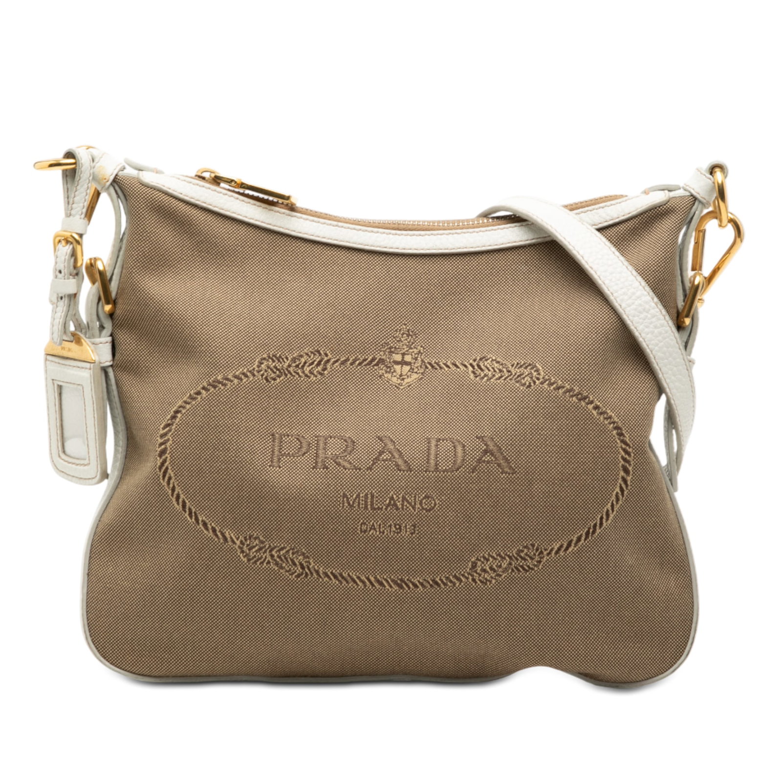 Prada Canapa Logo Canvas Crossbody Bag with Leather Trim: Prada Canapa Logo Canvas Crossbody Bag with Leather Trim This Prada Canvas Canapa Logo Crossbody bag features a brown fabric body with leather trim, a flat leather strap, a top zip closure, and an int