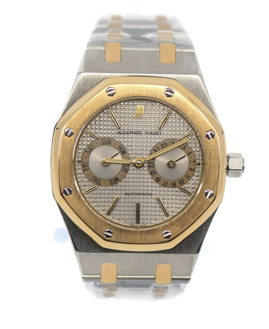 Audemars Piguet Royal Oak Day Date 18K Gold Stainless Steel Watch 25572SA: Audemars Piguet Royal Oak Day Date 18K Gold Stainless Steel Watch 25572SA The Audemars Piguet Royal Oak Day Date is a stunning wristwatch that combines luxury and functionality. This timepiece feature