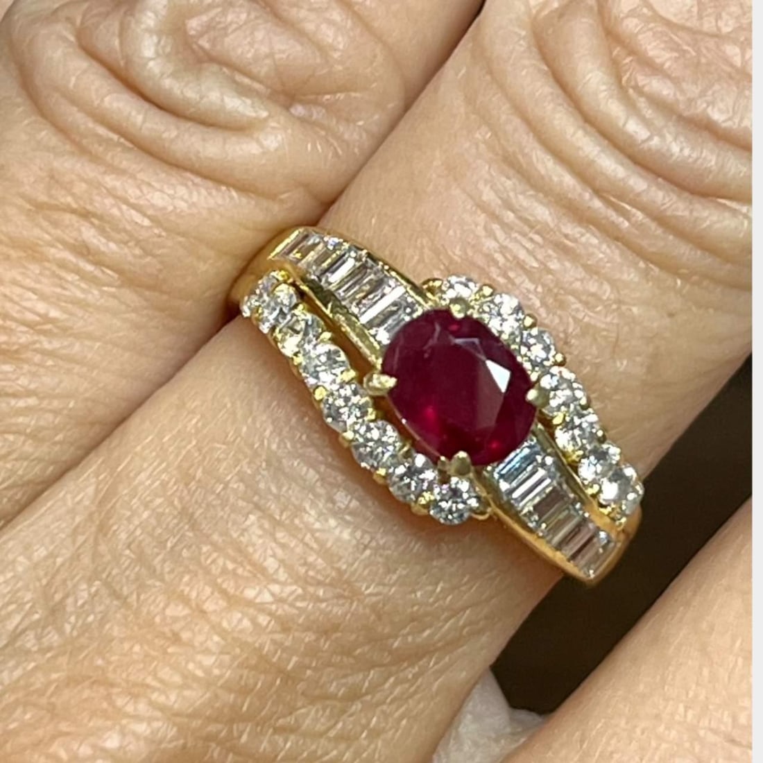 18K Yellow Gold Ruby 1.40 Ct and Diamond Ring with 30 Diamonds: 18K Yellow Gold Ruby 1.40 Ct and Diamond Ring with 30 Diamonds This stunning 18K Yellow Gold ring features a captivating ruby at its center, weighing approximately 1.40 Ct, complemented by an array of