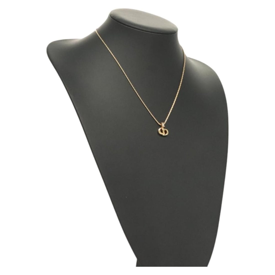 Christian Dior Gold Metal Necklace Made in Germany: Christian Dior Gold Metal Necklace Made in Germany This exquisite Christian Dior necklace is a stunning addition to any jewelry collection. Crafted in Germany, this piece showcases a sleek gold metal 