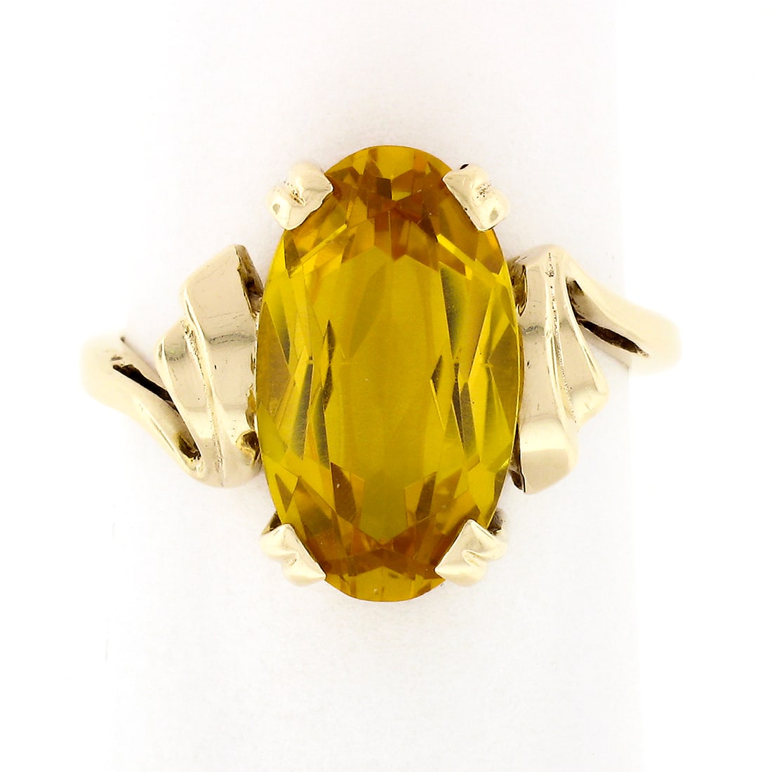 Vintage 10k Yellow Gold Elongated Oval Yellow Stone Solitaire Ring: Vintage 10k Yellow Gold Elongated Oval Yellow Stone Solitaire Ring Discover the elegance of this Vintage 10k Yellow Gold Old Faceted Elongated Oval Yellow Stone Solitaire Ring. Crafted from solid 10k 