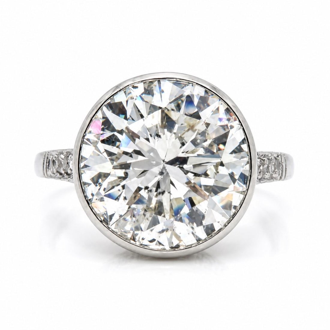 Platinum Art Deco Ring Featuring 5.25 Carat Diamond and Accent Stones: Platinum Art Deco Ring Featuring 5.25 Carat Diamond and Accent Stones This Art Deco platinum ring features a stunning approximately 5.25 carat diamond as the centerpiece, displaying J color and I1 cla