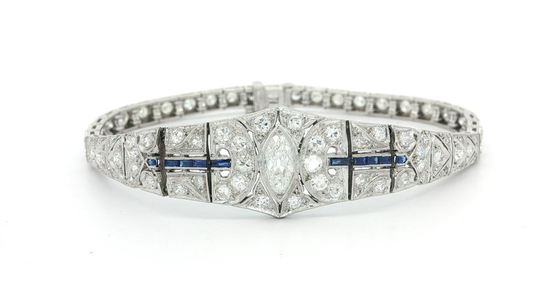 Antique Art Deco Platinum 3.25ct Diamond Sapphire Statement Bracelet: Antique Art Deco Platinum 3.25ct Diamond Sapphire Statement Bracelet This stunning Antique Art Deco bracelet is a true statement piece, intricately designed in solid platinum and adorned with a dazzli