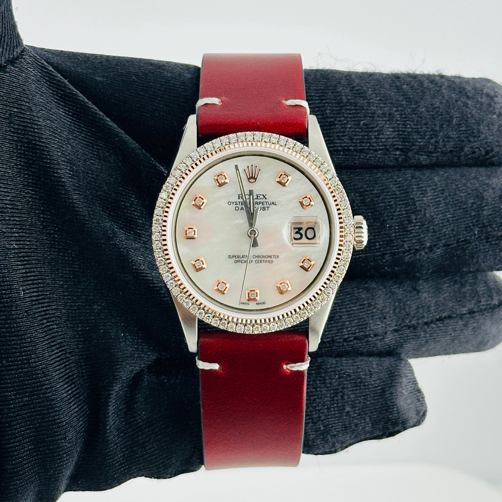 Datejust Reference 1601 Watch With Aftermarket MOP Diamond Dial and Leather Strap: Datejust Reference 1601 Watch With Aftermarket MOP Diamond Dial and Leather Strap This Rolex Datejust watch features an aftermarket white mother-of-pearl dial with rose diamond markers. It is equipped