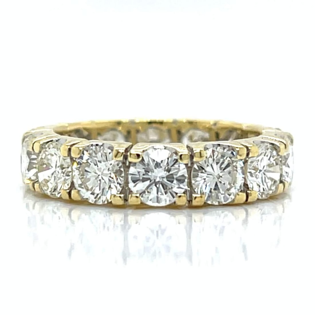 14 Diamond 18K Yellow Gold Eternity Band 5.30 Ct: 14 Diamond 18K Yellow Gold Eternity Band 5.30 Ct This exquisite 18K Yellow Gold Eternity Band features a stunning arrangement of 14 diamonds totaling approximately 5.30 carats. The diamonds are of H-I