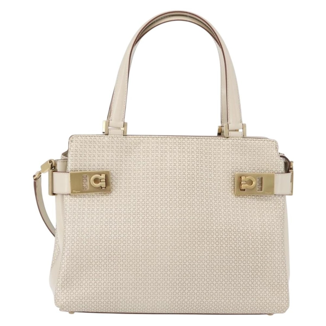 Double Gancini Side Buckle Beige Leather Tote by Salvatore Ferragamo: Double Gancini Side Buckle Beige Leather Tote by Salvatore Ferragamo This Salvatore Ferragamo Double Gancini Side Buckle Tote is crafted from beige leather and features signature side buckle accents. 