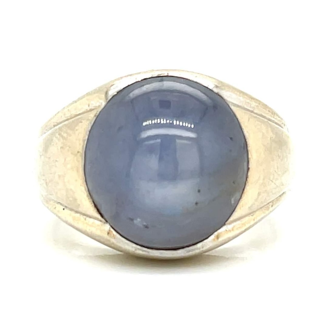 1960s 14K White Gold 17.35 Ct Star Sapphire Ring: 1960s 14K White Gold 17.35 Ct Star Sapphire Ring This exquisite ring features a stunning 17.35 Ct. star sapphire, beautifully set in 14K white gold. Weighing 14.4 grams, this piece is a true statement
