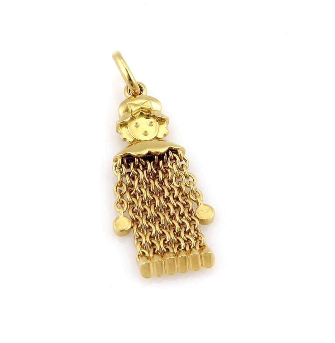 Pomellato 18k Yellow Gold Girl Charm Pendant: Pomellato 18k Yellow Gold Girl Charm Pendant This authentic Pomellato Dangling Girl charm pendant is crafted from 18k yellow gold and showcases a whimsical, stylized girl silhouette suspended from a f