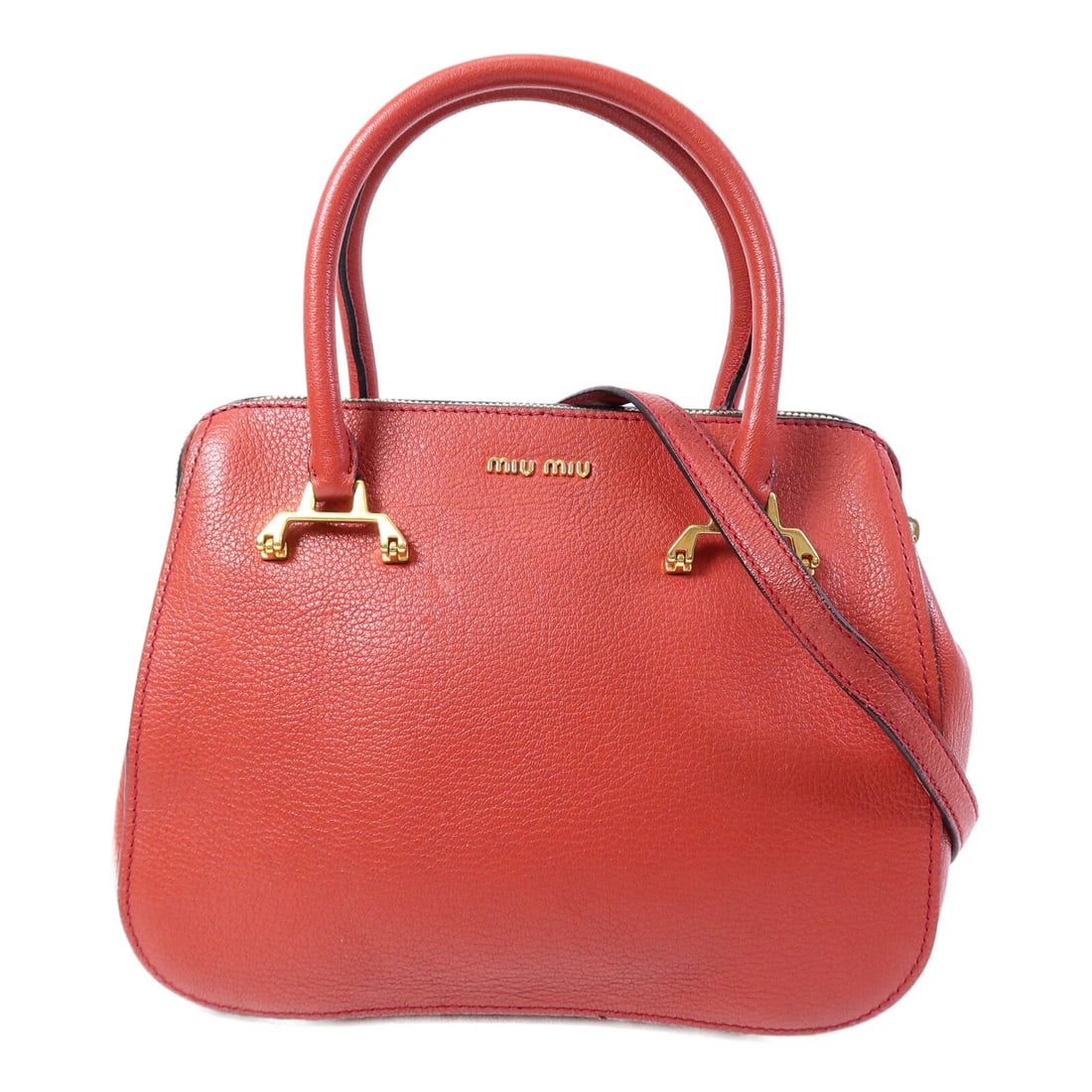 Miu Miu Red Calfskin 2 Way Shoulder Bag GHW: Miu Miu Red Calfskin 2 Way Shoulder Bag GHW This Miu Miu 2-way shoulder bag is crafted from luxurious red calfskin leather, offering both versatility and style. Designed for women, it features a spaci