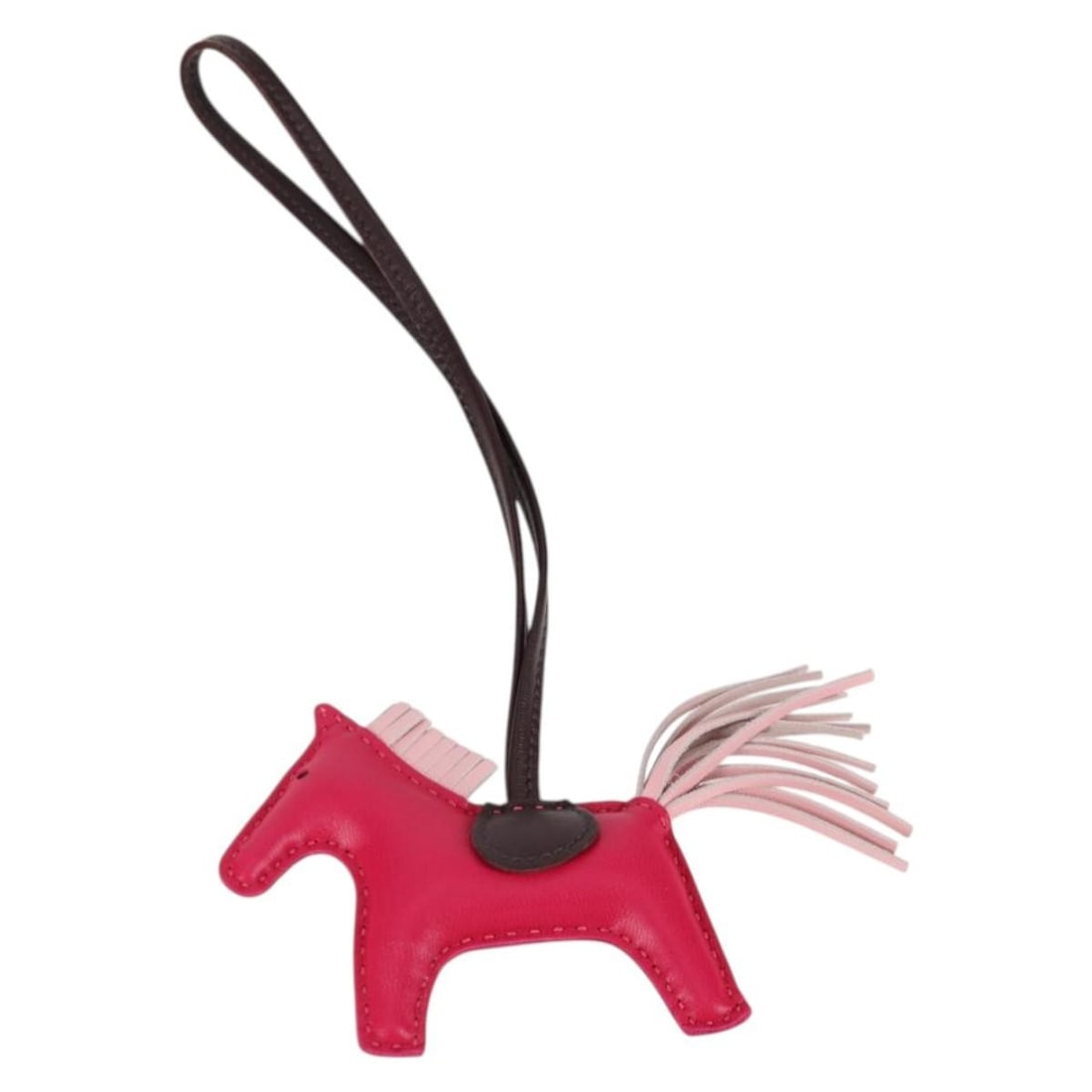 Hermes Pink Leather Rodeo PM Bag Charm with Box: Hermes Pink Leather Rodeo PM Bag Charm with Box This Hermes Rodeo Charm PM is crafted from pink leather and designed as a stylish accessory for bags. Made in France, it features a compact silhouette a