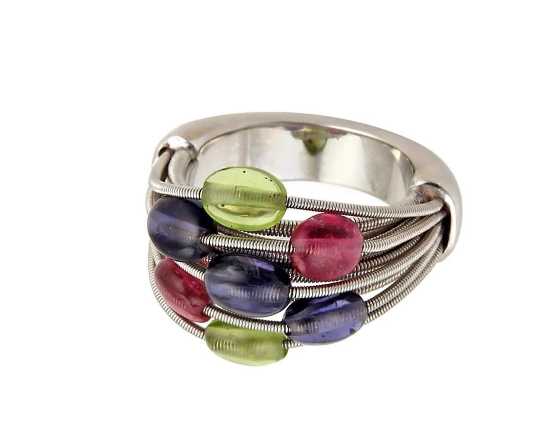 Marco Bicego 18k White Gold Flex Ring with Tourmaline and Amethyst Size 7: Marco Bicego 18k White Gold Flex Ring with Tourmaline and Amethyst Size 7 This Marco Bicego ring features a flexible band crafted from 18k white gold, showcasing a sculptural silhouette. It is accente